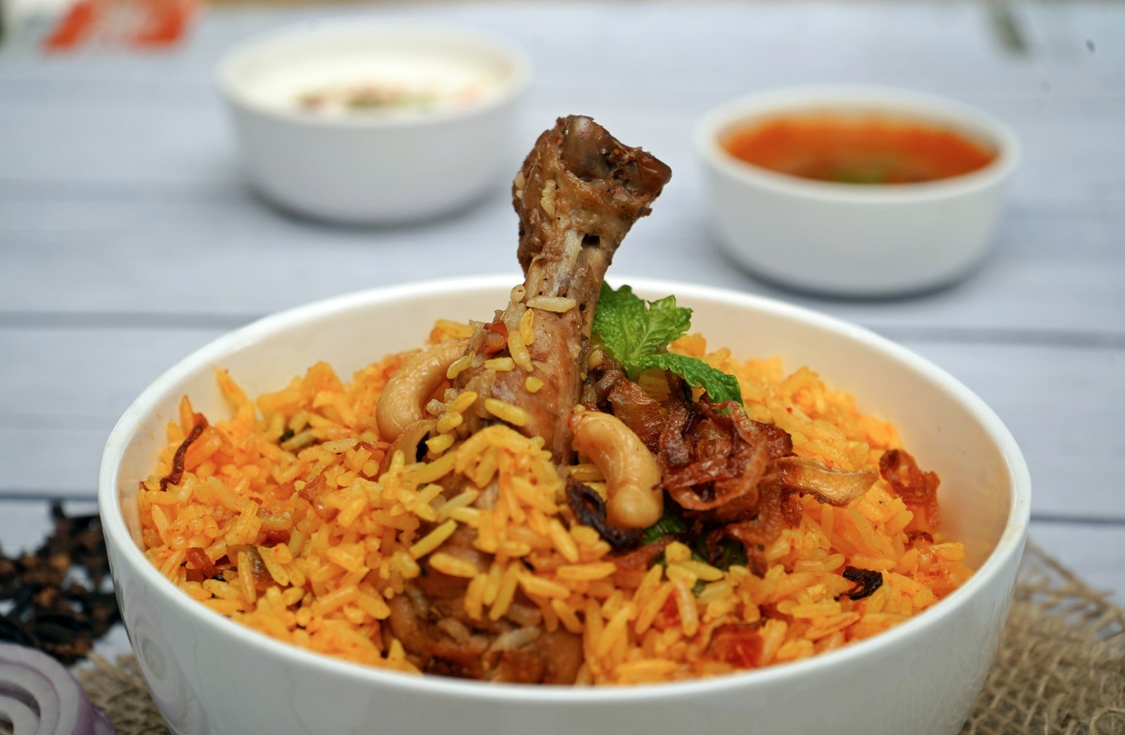 White bowl filled with spiced rice and meat